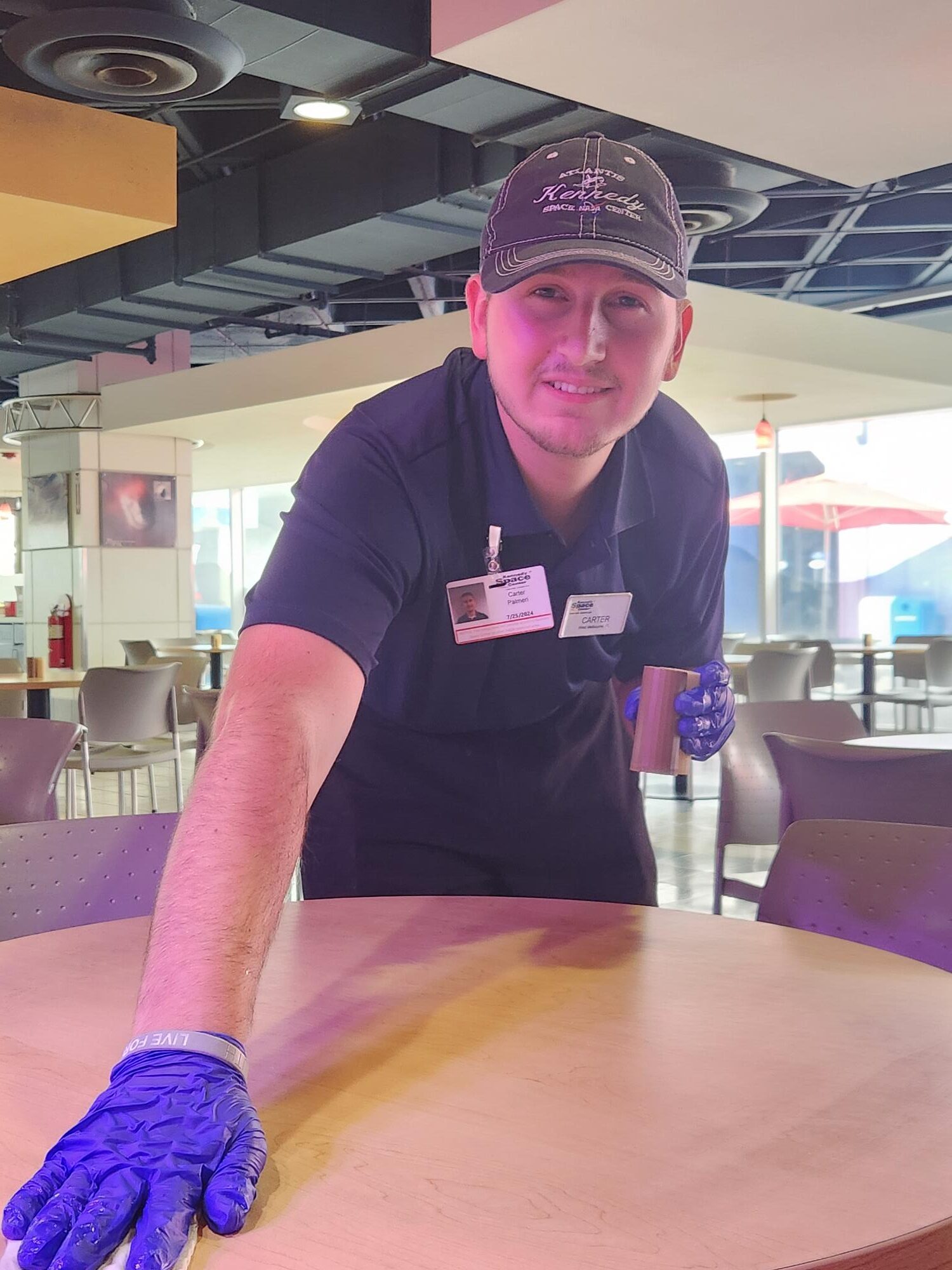 WBLE Youth Program Student at KSC wiping tables.