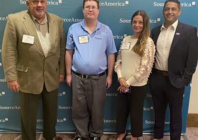 BAC's John Saddler and Amar Patel with InspiriTec's Melanie and self-advocate Stephen at 2025 Grassroots