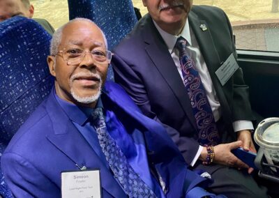 Simeon Fowler, BAC and Armando Contreras, SourceAmerica sitting on a bus on the way to the Capital Building in Washington D.C.
