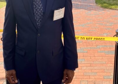 BAC Grassroots self-advocate Simeon Fowler standing outside with the Whithouse in the background
