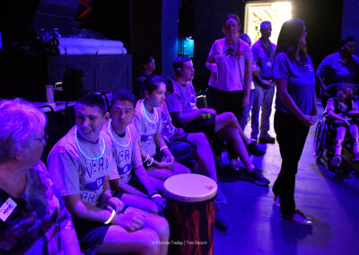 Viera Middle School students, wearing glowing necklaces and bracelets, wait backstage to perform at the Brevard Achievement Center (BAC) 12th Annual Performing Arts Showcase at the King Center in Melbourne.