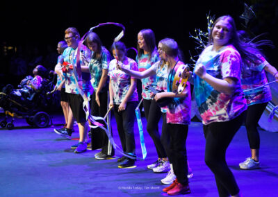 Astronaut High School students wearing tie dyed shirts performing at the BAC 12th Annual Performing Arts Showcase at the King Center in Melbourne.