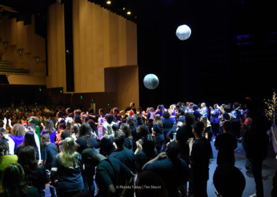 Plastic Beach balls that look like space rocks floating above the performers during the Grand Finale of the 12th Annual BAC Performing Arts Showcase in Melbourne.