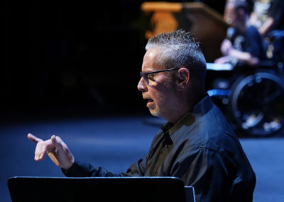 ASL Interpreter, John Favuzza on stage at the 12th Annual BAC Performing Arts Showcase.