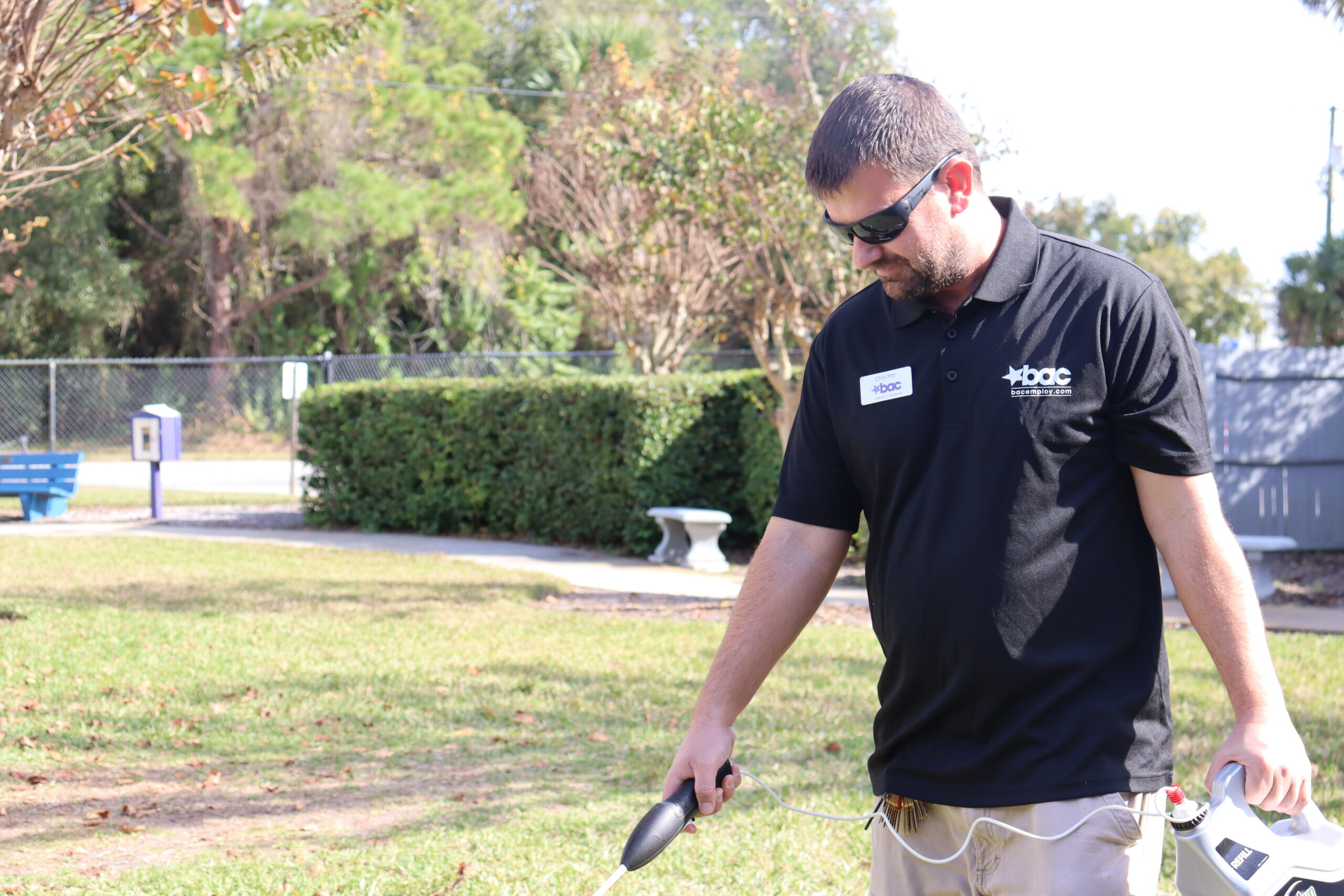 BAC Employee doing preventative grounds maintenance