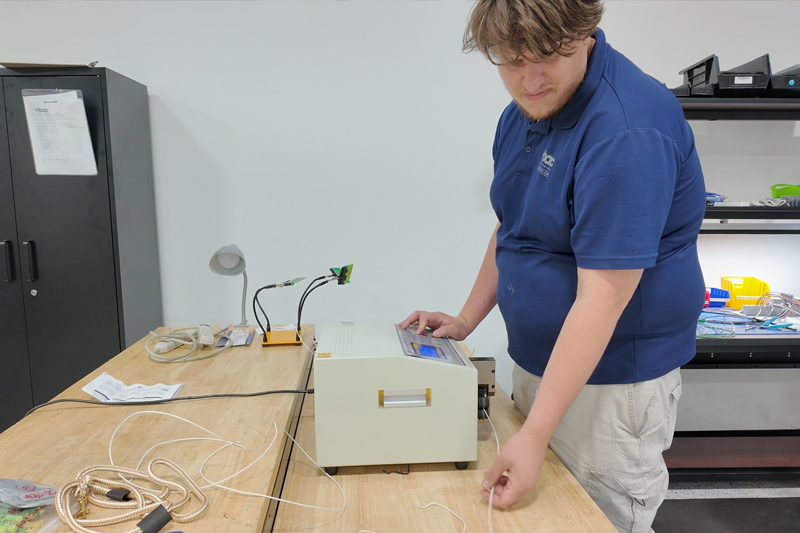 BAC employee creating custom cable and wire harness assemblies