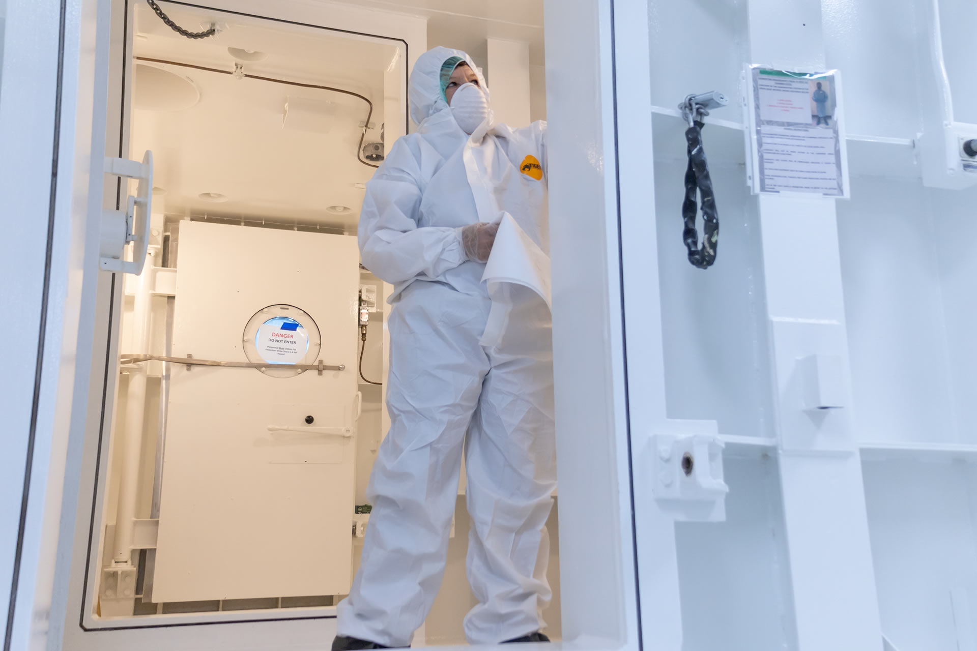 Working in a clean room environment with protective clothing